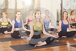 Group of young women in yoga class