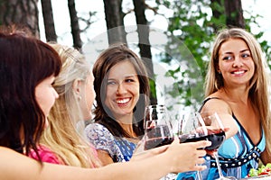 Group of young womens drinking wine