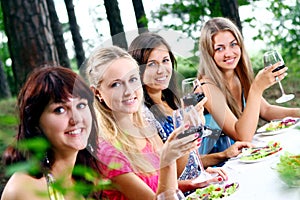 Group of young womens drinking wine