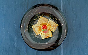 Grouper ravioli with bottarga and cherry tomatoes