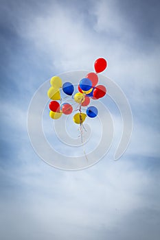 Grouping of Balloons Floating Away photo