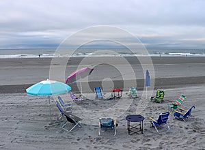 Grouping of beach chairs arranged in circle, Long Sands Beach, York, Maine, summer, 2022