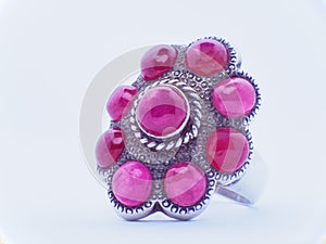 grouping of color gemstone rings with colored diamonds and gemstones on white background