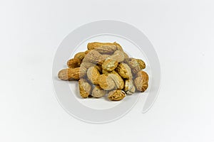 A grouping of peanuts on a white background