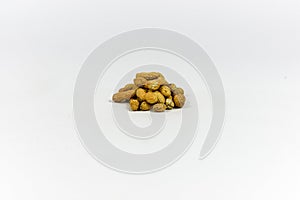 A grouping of peanuts on a white background