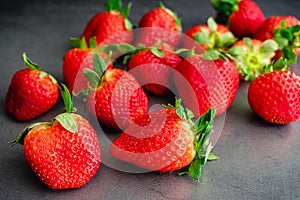 Fresh Whole Strawberries on a Dark Background