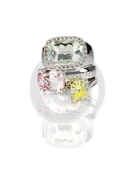 Grouping of three colored gemstone diamond rings stacked