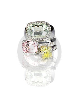 Grouping of three colored gemstone diamond rings stacked photo