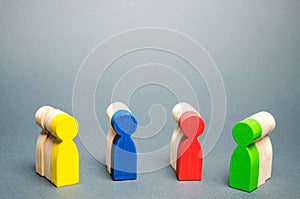 Groups of multicolored wooden people. The concept of market segmentation. Customer relationship management. Target audience,