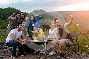Groups of Multiculturalism Friends Relaxing are Enjoying Outside Tents Camping photo