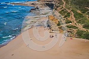 Groups of people taking surf lessons on the beach, Ribeira D\'Ilhas, Ericeira PORTUGAL photo