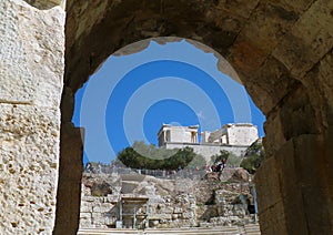 Groups of Visitor at The Acropolis as Seen from the Odeon of Herodes Atticus in Athens, Greece