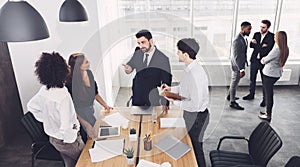 Groups of young business people communicating in office