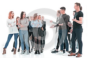 Groups of young men and women standing opposite