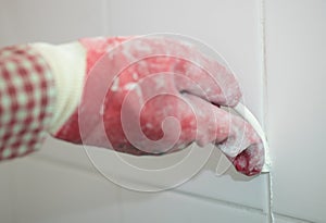 Grouting ceramic tiles