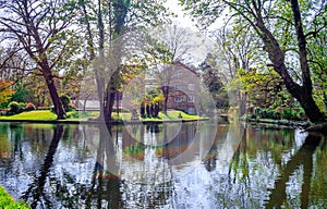 Grove Mill and old Mill House by the river Gade. Cassiobury Park, Watford, London