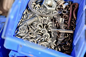 Grover washers in stock in a blue box in a locksmith`s shop photo