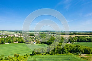 The groves around the town of Ranville in Europe, France, Normandy, towards Caen, Ranville, in summer on a sunny day photo