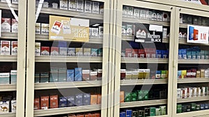 Food Lion grocery store secured packs of cigarettes glass case