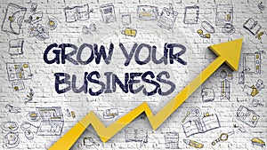 Grow Your Business Drawn on White Wall. photo