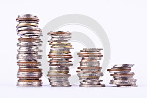 Growing money graph on a row of coin on white background finance business isolated