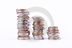 Growing money graph on a three row of coin and pile of bath coins stack on white background finance business isolated