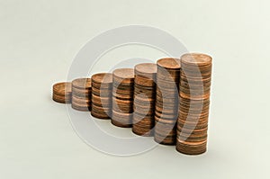 Growing mountain of coins in denomination of two euro cents on white background