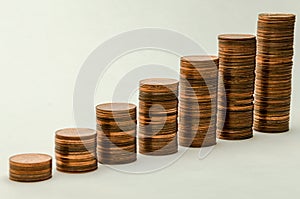 Growing mountain of coins in denomination of two euro cents on white background