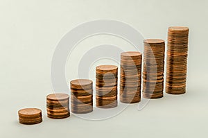 Growing mountain of coins in denomination of two euro cents on white background