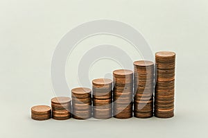 Growing mountain of coins in denomination of two euro cents on white background