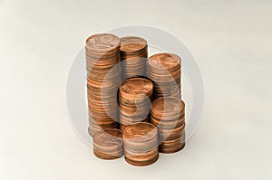 Growing mountain of coins in denomination of two euro cents on white background