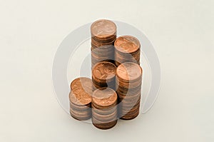 Growing mountain of coins in denomination of two euro cents on white background