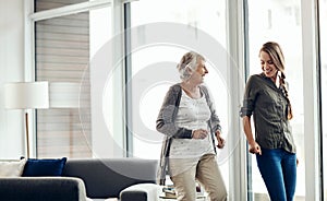 Growing old is one thing but acting old is another. a senior woman and her adult daughter dancing together at home.