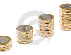 Growing one euro coin stack isolated on white background