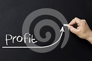 Growing profit concept. Businessman draw accelerating line of improving profit.