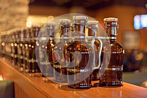 Growlers lined up on the bar ready to be filled