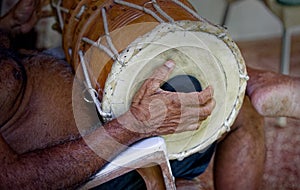 Grown man playing dolak drum, traditional percussion instrument, player, drummer