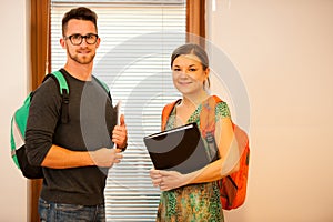 Grownup couple representing lifelong learning. Couple with school bag smiling as a gesture of happiness and joy to study.