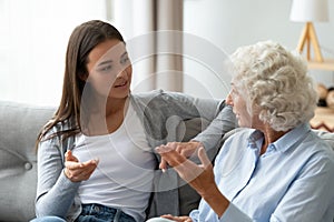 Grownup daughter talking enjoy time with mature mum