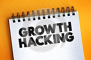 Growth Hacking text quote on notepad, concept background
