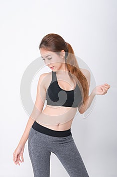 Growth portrait of fitness woman in sportswear