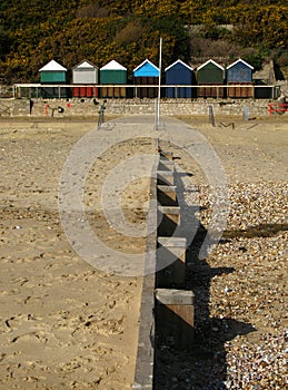 Groyne and beach huts photo