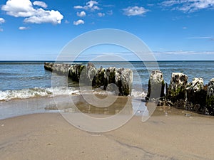 Groyne on the beach on the Polish Baltic Sea coast photo