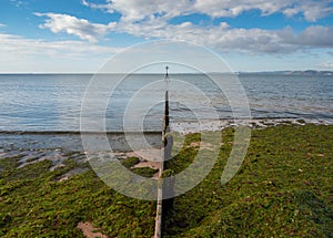 Groyne with marker beacon in the distance