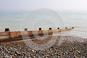 Groyne on shingle beach. UK photo