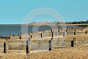 Groynes on the beach with Herne Bay in Thanet, Kent in the background