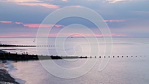 Groynes at Cromer at sunset