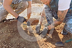 Groznii, Chechen Republic, Russia - Oct. 2018: Archaeological excavations. Two archaeologists with tools conducting research on hu