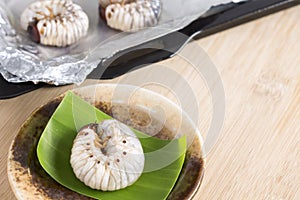 Grub Worms or Coconut Rhinoceros Beetle. Food Insects for eating larvae fried or baked on plate and on baking tray is good source