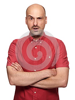 Grumpy bald man looking at camera